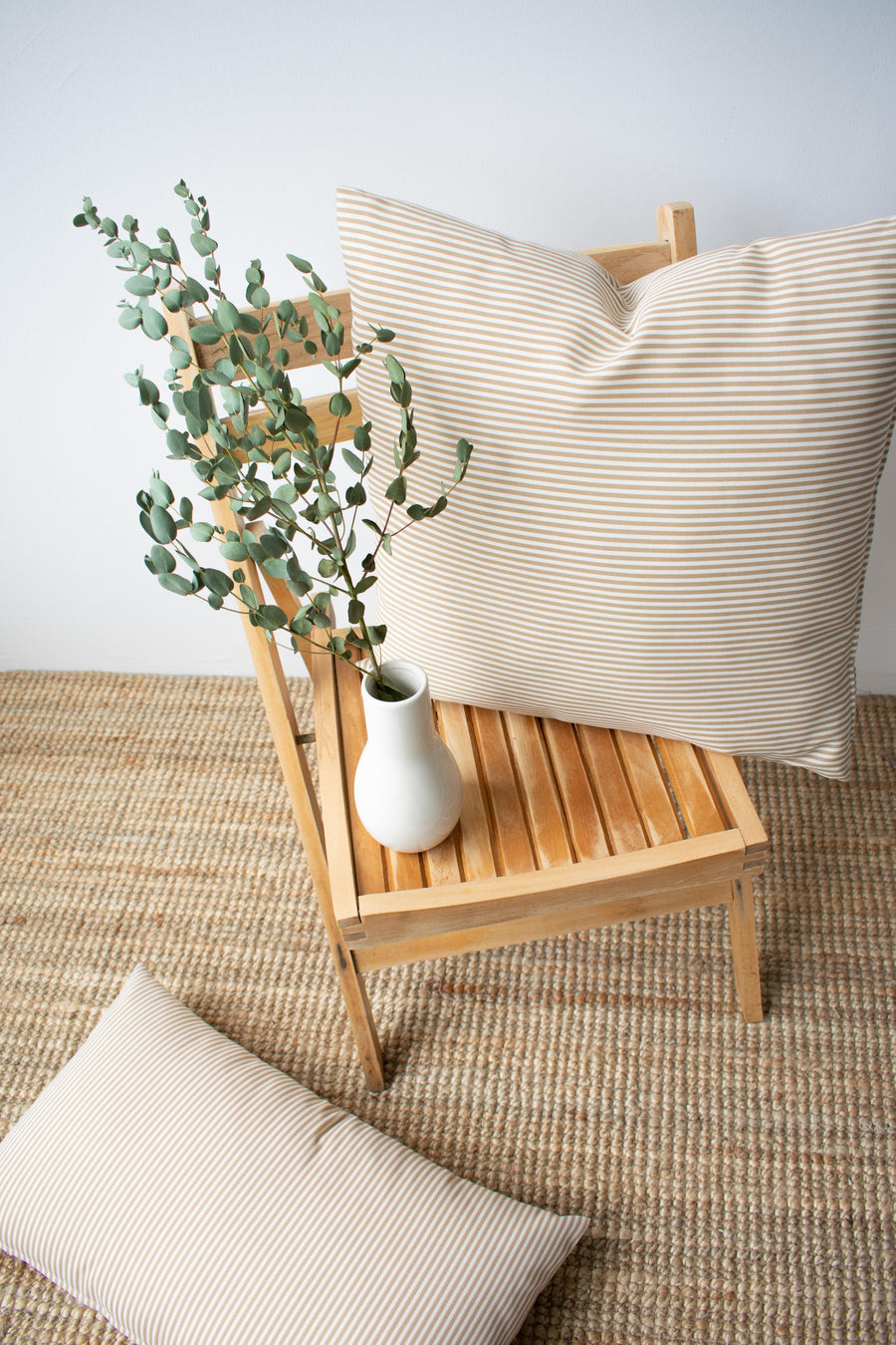Outdoor_Pillow_20_20_Tan_Stripe_on_Chair